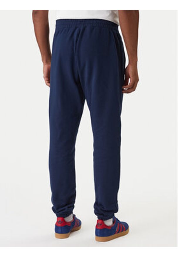 Adidas - adidas Spodnie dresowe Trefoil Essentials JD2423 Granatowy Slim Fit. Kolor: niebieski. Materiał: bawełna