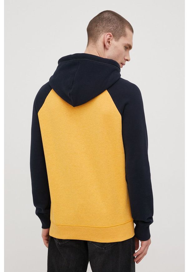 Superdry bluza męska kolor żółty z kapturem wzorzysta. Okazja: na co dzień. Typ kołnierza: kaptur. Kolor: żółty. Materiał: bawełna, dzianina. Długość rękawa: raglanowy rękaw. Wzór: aplikacja. Styl: casual
