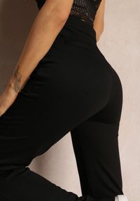 Renee - Czarne Spodnie Szerokie Tanora. Kolor: czarny. Materiał: tkanina. Długość: długie. Wzór: gładki, jednolity, aplikacja