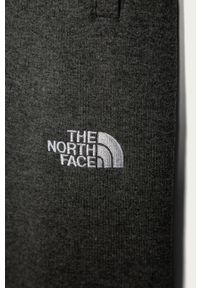The North Face - Spodnie dziecięce 122-163 cm. Kolor: szary. Materiał: bawełna, poliester, dzianina. Wzór: melanż #3