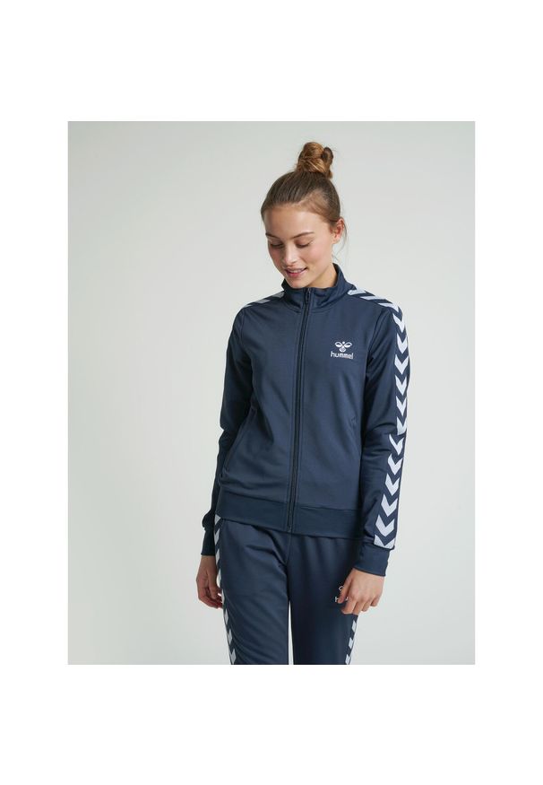 Damska kurtka zapinana na zamek Hummel hmlnelly 2.0. Kolor: wielokolorowy, niebieski, zielony. Sezon: zima. Sport: fitness, piłka nożna