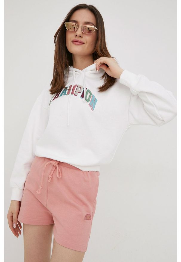 Champion bluza damska kolor biały z kapturem z aplikacją. Typ kołnierza: kaptur. Kolor: biały. Materiał: włókno. Długość rękawa: długi rękaw. Długość: długie. Wzór: aplikacja