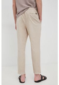 JOOP! - Joop! spodnie męskie kolor beżowy dopasowane. Kolor: beżowy. Materiał: tkanina. Wzór: gładki