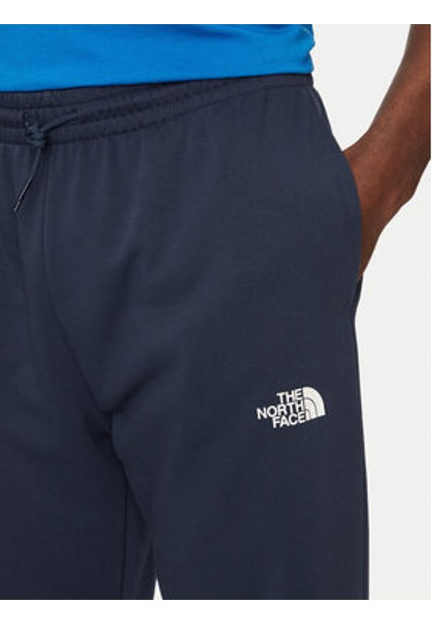 The North Face Spodnie dresowe Simple Dome Light NF0A8C41 Granatowy Regular Fit. Kolor: niebieski. Materiał: syntetyk, bawełna
