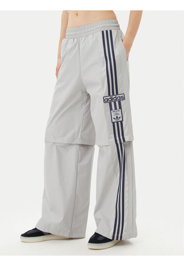 Adidas - adidas Spodnie dresowe Adibreak JJ3122 Szary Regular Fit. Kolor: szary. Materiał: syntetyk