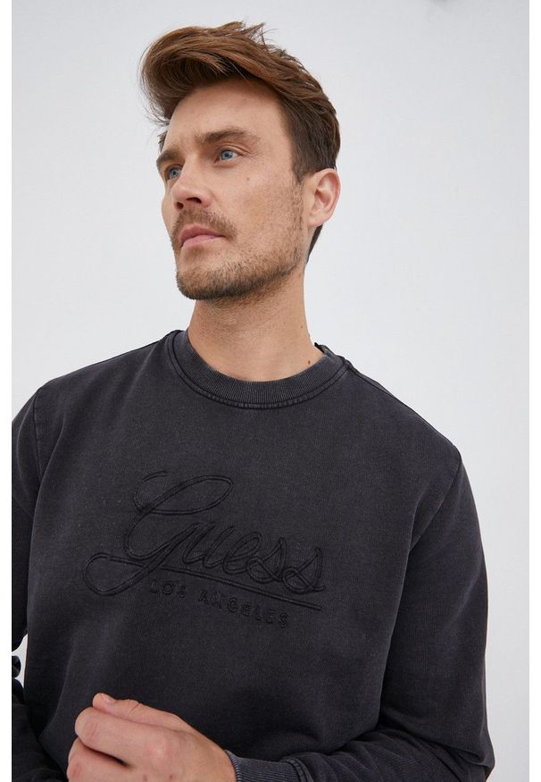 Guess - Bluza bawełniana. Okazja: na co dzień. Kolor: czarny. Materiał: bawełna. Wzór: aplikacja. Styl: casual