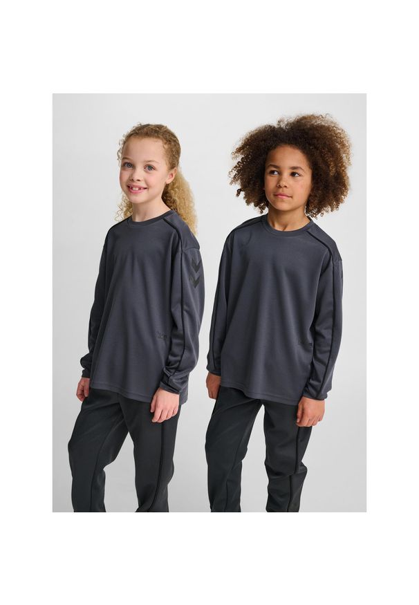 Dziecięcy dżersej z długim rękawem Hummel. Kolor: szary, wielokolorowy, brązowy, czarny. Materiał: jersey. Długość rękawa: długi rękaw. Długość: długie. Sport: piłka ręczna