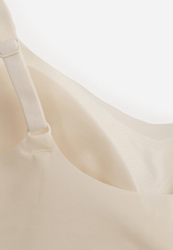 Renee - Jasnobeżowy Usztywniany Biustonosz o Bezszwowym Wykończeniu Bez Fiszbin Leanoreth. Kolor: beżowy. Wzór: gładki