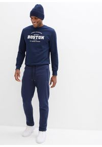 bonprix - Spodnie sportowe z praktycznymi kieszeniami zapinanymi na zamek. Kolor: niebieski. Styl: sportowy #2