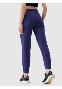 4f - 4F Spodnie dresowe joggery damskie - granatowe XL. Kolor: niebieski. Materiał: dresówka. Wzór: gładki, ze splotem
