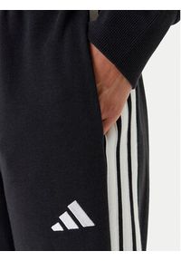 Adidas - adidas Spodnie dresowe Essentials 3-Stripes JD5302 Czarny Regular Fit. Kolor: czarny. Materiał: bawełna #5
