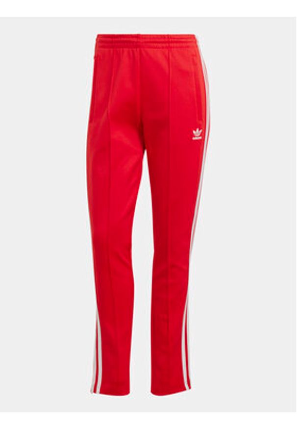 Adidas - adidas Spodnie dresowe adicolor SST IK6603 Czerwony Slim Fit. Kolor: czerwony. Materiał: bawełna
