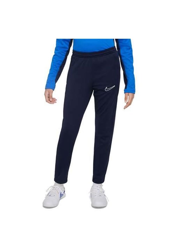 Spodnie sportowe chłopięce Nike Junior Dri-fit Academy 23. Kolor: niebieski, wielokolorowy. Materiał: dresówka. Technologia: Dri-Fit (Nike)