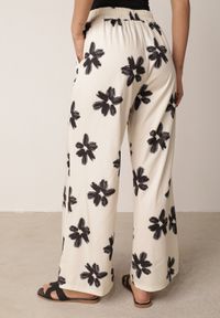 Born2be - Czarno-Kremowe Spodnie o Szerokim Kroju z Wysokim Stanem w Kwiaty Ozdobione Wiązaniem Neatea. Okazja: do pracy, na co dzień. Stan: podwyższony. Kolor: beżowy. Wzór: aplikacja, kwiaty. Styl: casual #5