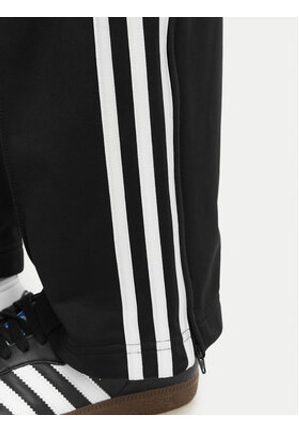 Adidas - adidas Spodnie dresowe Firebird Classic KD5575 Czarny Regular Fit. Kolor: czarny. Materiał: syntetyk