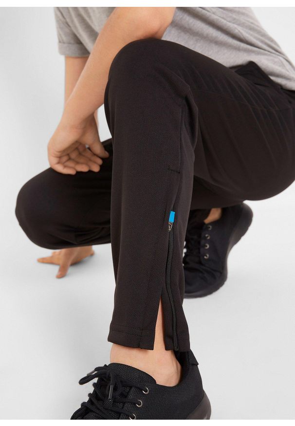 bonprix - Spodnie sportowe, oddychające i szybko schnące. Kolor: czarny. Materiał: materiał. Styl: sportowy