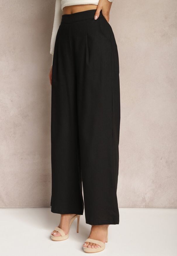 Renee - Czarne Szerokie Spodnie z Lnem z Gumką w Talii Airelttis. Kolor: czarny. Materiał: len. Sezon: lato. Styl: elegancki