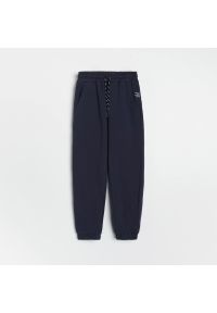 Reserved - Dresowe spodnie z kieszeniami - Granatowy. Kolor: niebieski. Materiał: dresówka #1