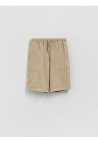 Reserved - Bawełniane szorty - beżowy. Kolor: beżowy. Materiał: bawełna. Wzór: gładki #1