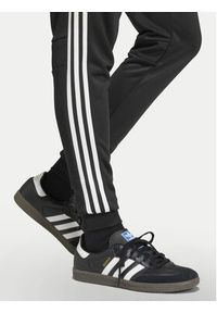 Adidas - adidas Spodnie dresowe Tiro 25 Essentials Sweat JC5464 Czarny Regular Fit. Kolor: czarny. Materiał: syntetyk #2