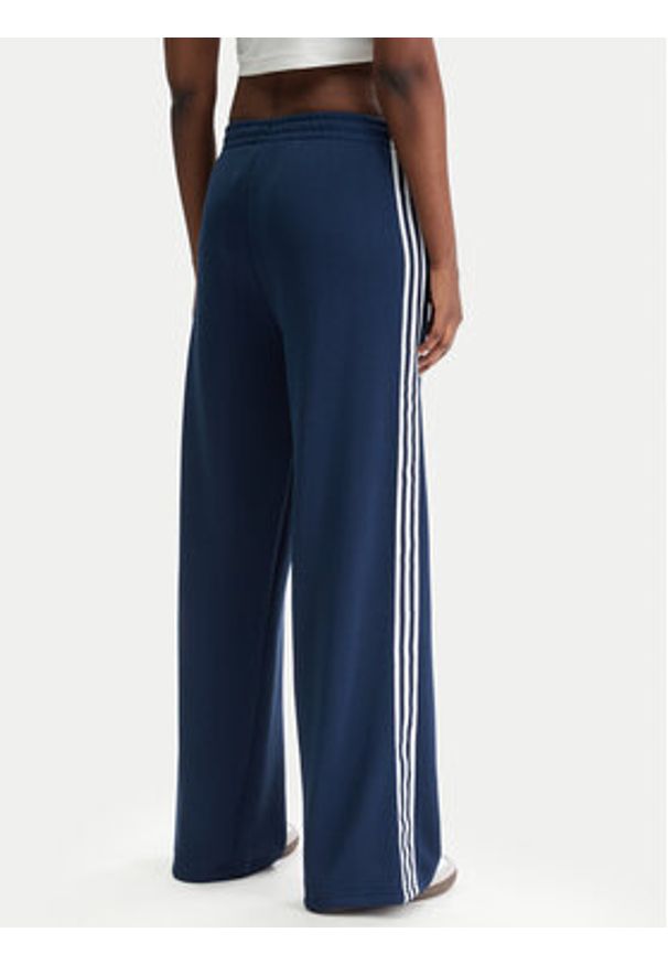 Adidas - adidas Spodnie dresowe adicolor Firebird JV7524 Granatowy Regular Fit. Kolor: niebieski. Materiał: syntetyk