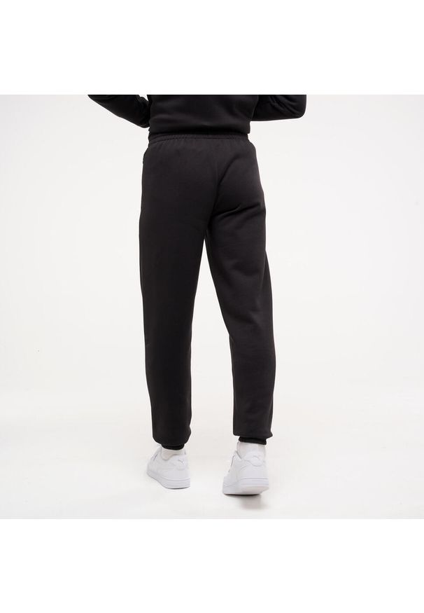 Spodnie dresowe męskie Puma Gym & Pilates. Kolor: czarny. Materiał: dresówka. Sport: joga i pilates