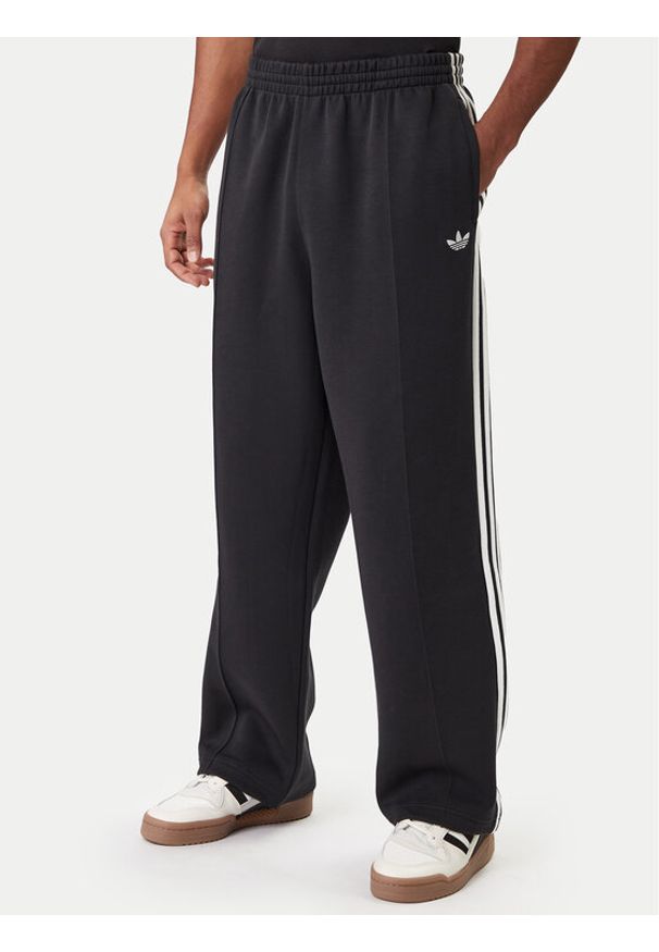 Adidas - adidas Spodnie dresowe adicolor Spacer Track JX1506 Czarny Baggy Fit. Kolor: czarny. Materiał: bawełna. Sport: turystyka piesza