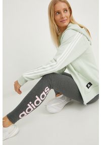 Adidas - adidas legginsy damskie kolor szary z nadrukiem. Kolor: szary. Materiał: bawełna, dzianina, materiał. Wzór: nadruk
