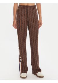 Lacoste Spodnie dresowe XF9313 Brązowy Regular Fit. Kolor: brązowy. Materiał: syntetyk