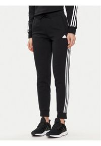 Adidas - adidas Spodnie dresowe Future Icons 3-Stripes IN9479 Czarny Regular Fit. Kolor: czarny. Materiał: bawełna