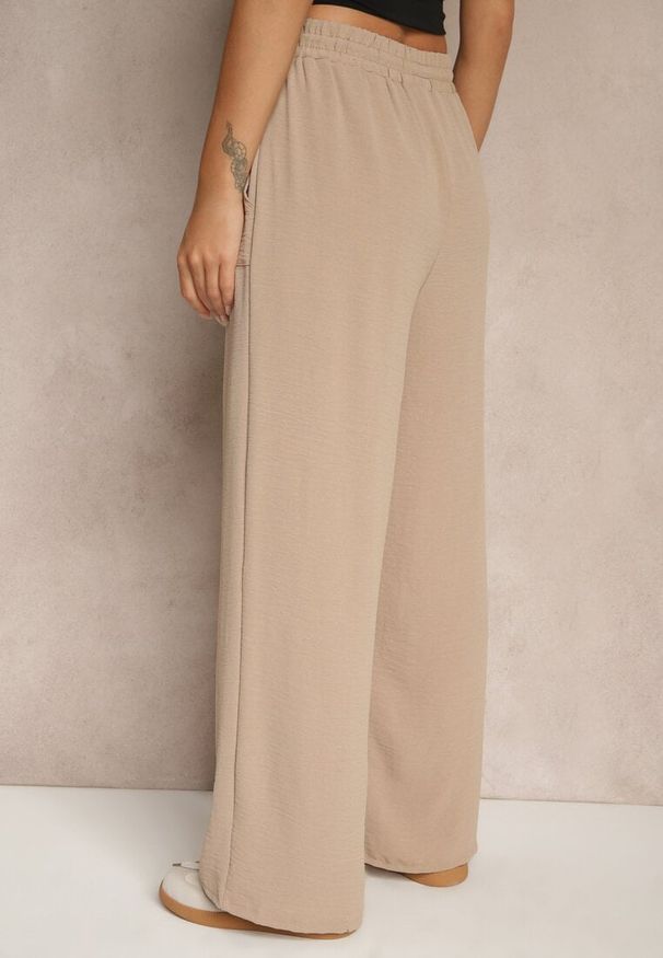 Renee - Ciemnobeżowe Szerokie Spodnie z Wiskozą z Gumką w Pasie Lealirre. Okazja: na co dzień. Kolor: beżowy. Materiał: wiskoza. Wzór: gładki. Styl: casual