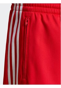 Adidas - adidas Spodnie dresowe adicolor Classics Firebird IJ7057 Czerwony Regular Fit. Kolor: czerwony. Materiał: syntetyk