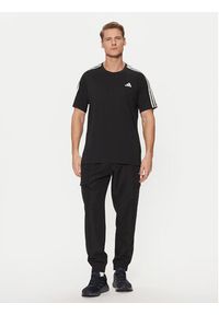 Adidas - adidas Koszulka techniczna Own the Run 3-Stripes IQ3834 Czarny Regular Fit. Kolor: czarny. Materiał: syntetyk. Sport: bieganie