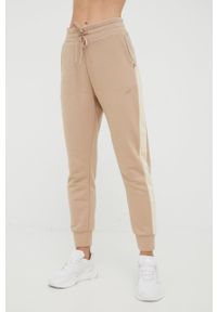 4f - 4F spodnie dresowe damskie kolor beżowy gładkie. Kolor: beżowy. Materiał: dresówka. Wzór: gładki