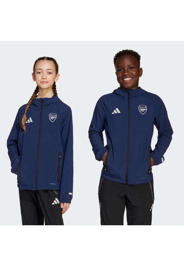 Adidas - Kurtka Arsenal Tiro 25 Competition Vis Tech Travel. Kolor: niebieski. Materiał: dresówka. Sport: piłka nożna