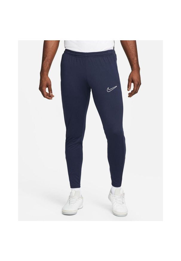 Spodnie sportowe męskie Nike DF Academy 23. Kolor: niebieski, wielokolorowy, biały. Materiał: syntetyk, materiał. Długość: długie