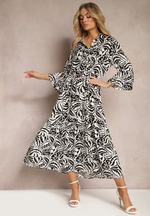 Renee - Czarno-Biała Sukienka Maxi z Falbanką z Guzikami i Liściastym Wzorem Polka. Kolor: czarny. Długość rękawa: długi rękaw. Styl: elegancki. Długość: maxi