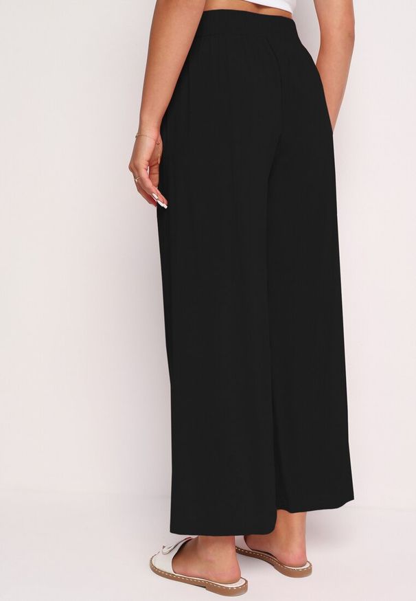 Born2be - Czarne Bawełniane Szerokie Spodnie Alladynki z Wysokim Stanem i Gumką w Talii Risalles. Okazja: na co dzień. Stan: podwyższony. Kolor: czarny. Materiał: bawełna. Styl: casual, elegancki