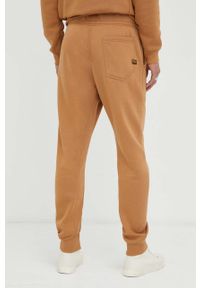 G-Star RAW - G-Star Raw spodnie dresowe kolor brązowy gładkie. Kolor: brązowy. Materiał: dresówka. Wzór: gładki #3