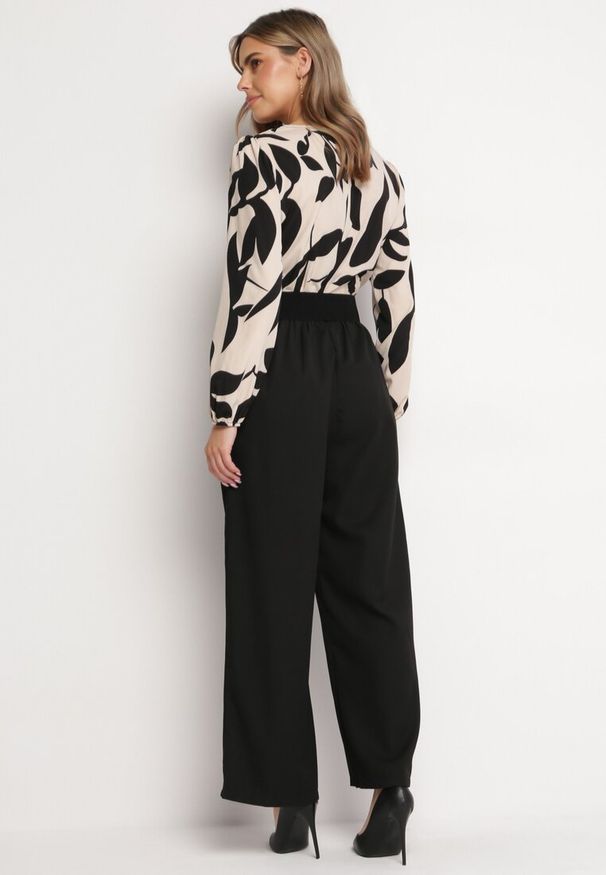 Born2be - Beżowo-Czarny Elegancki Kombinezon ze Wzorzystą Górą Szerokimi Nogawkami i Paskiem Grepia. Okazja: na co dzień. Kolor: czarny. Styl: elegancki