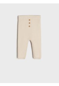 Sinsay - Spodnie - kremowy. Kolor: kremowy. Materiał: dzianina #1
