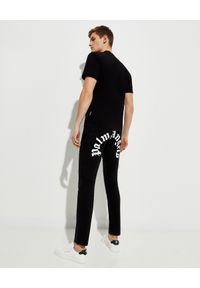 PALM ANGELS - Czarne jeansy z logo. Kolor: czarny. Długość: długie. Wzór: aplikacja, nadruk. Styl: klasyczny #5