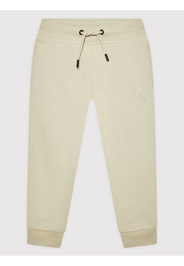 Guess Spodnie dresowe L2YQ46 KAIJ1 Beżowy Regular Fit. Kolor: beżowy. Materiał: bawełna