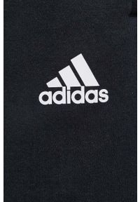 Adidas - adidas spodnie damskie kolor czarny gładkie. Stan: podwyższony. Kolor: czarny. Materiał: materiał, włókno, bawełna, dzianina. Wzór: gładki