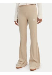 Adidas - adidas Legginsy Essentials KD3850 Beżowy Flared Leg. Kolor: beżowy. Materiał: bawełna, wiskoza #1