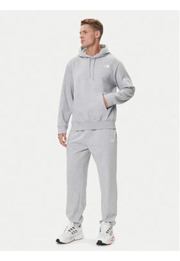 The North Face Spodnie dresowe Essential NF0A8C1F Szary Relaxed Fit. Kolor: szary. Materiał: bawełna