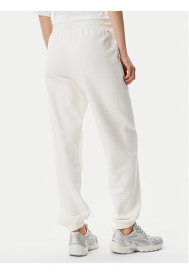 Tommy Jeans Spodnie dresowe Script DW0DW20670 Écru Relaxed Fit. Kolor: kremowy. Materiał: bawełna