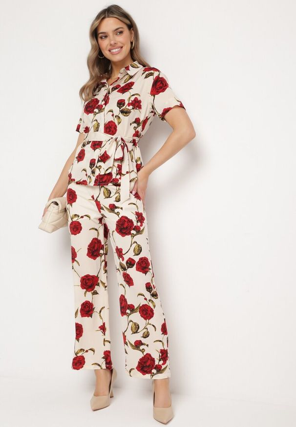 Born2be - Beżowo-Bordowe Spodnie Szerokie w Kwiaty z Kieszeniami Cucumia. Okazja: na co dzień, na spotkanie biznesowe, na imprezę. Stan: podwyższony. Kolor: beżowy. Materiał: wiskoza. Wzór: kwiaty. Sezon: wiosna, lato. Styl: casual, biznesowy, elegancki, klasyczny