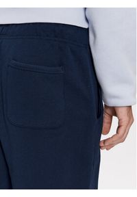 Tommy Jeans Spodnie dresowe Badge DM0DM18355 Granatowy Regular Fit. Kolor: niebieski. Materiał: bawełna #5