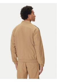 Adidas - adidas Bluza adicolor Woven Firebird JY1333 Beżowy Loose Fit. Kolor: beżowy. Materiał: syntetyk #3